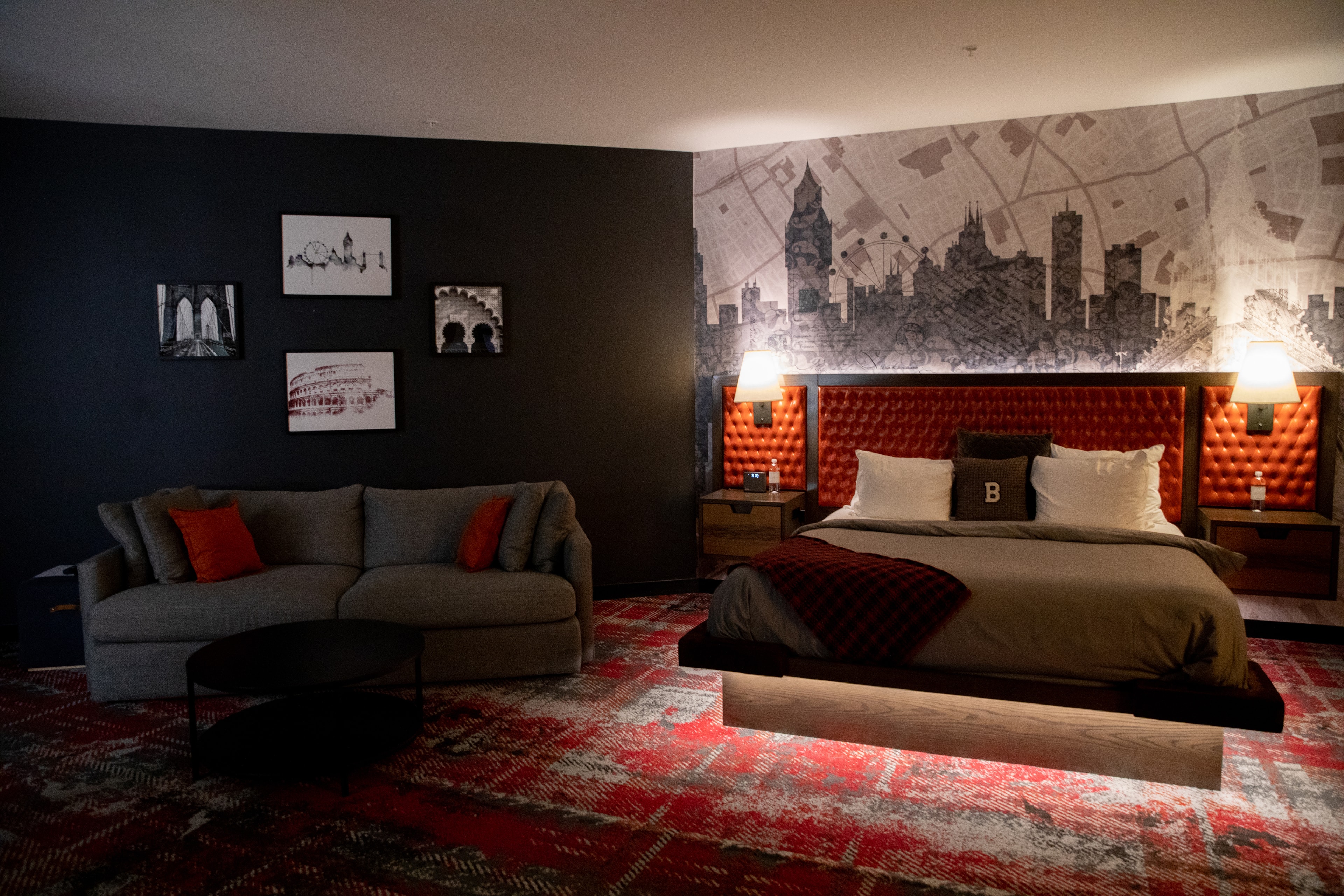 Modern Hotel Bedroom with Cityscape Mural — Spaces photography by Spice & Ink