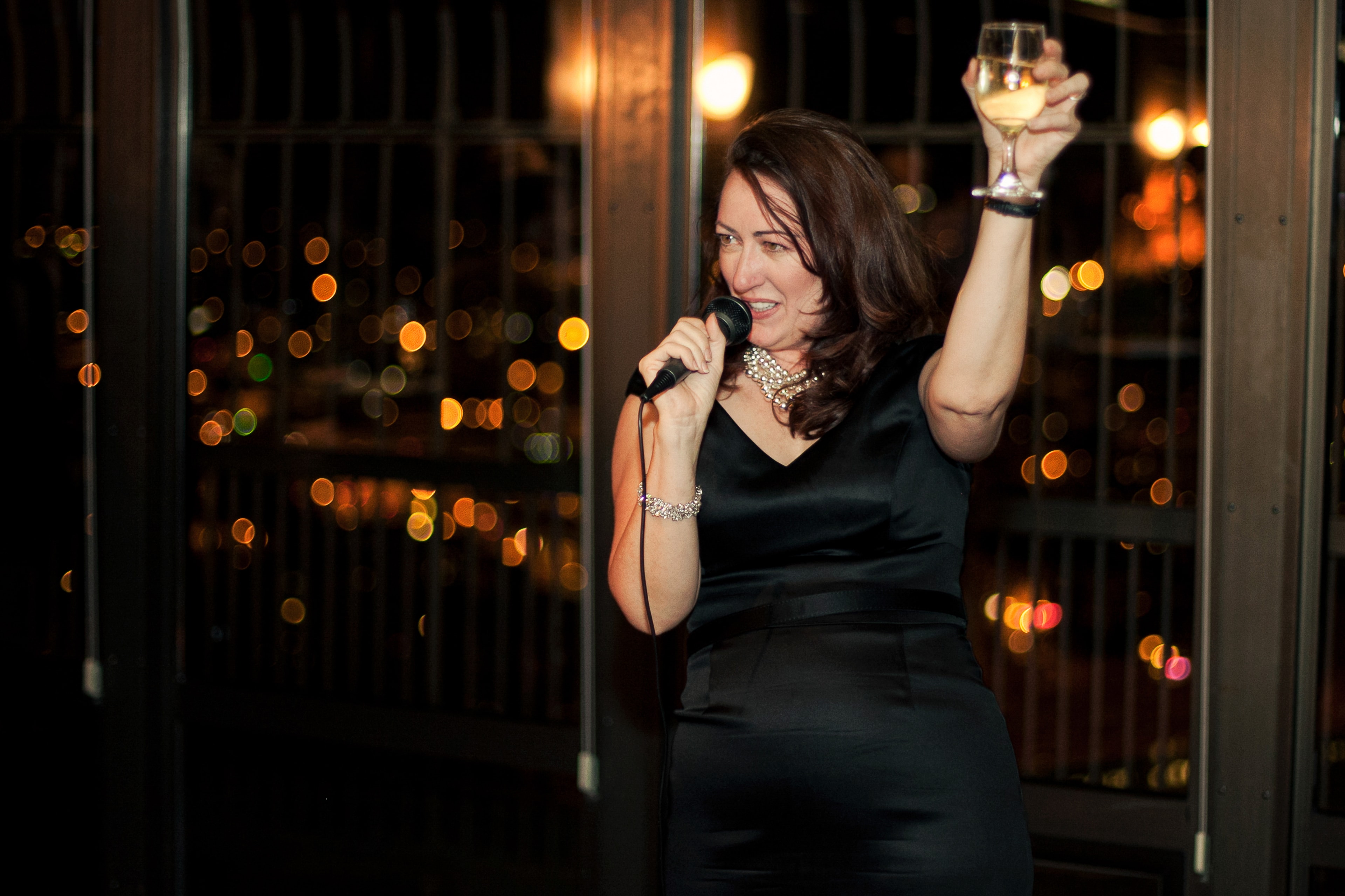 Singer with Microphone and Wine — Events photography by Spice & Ink