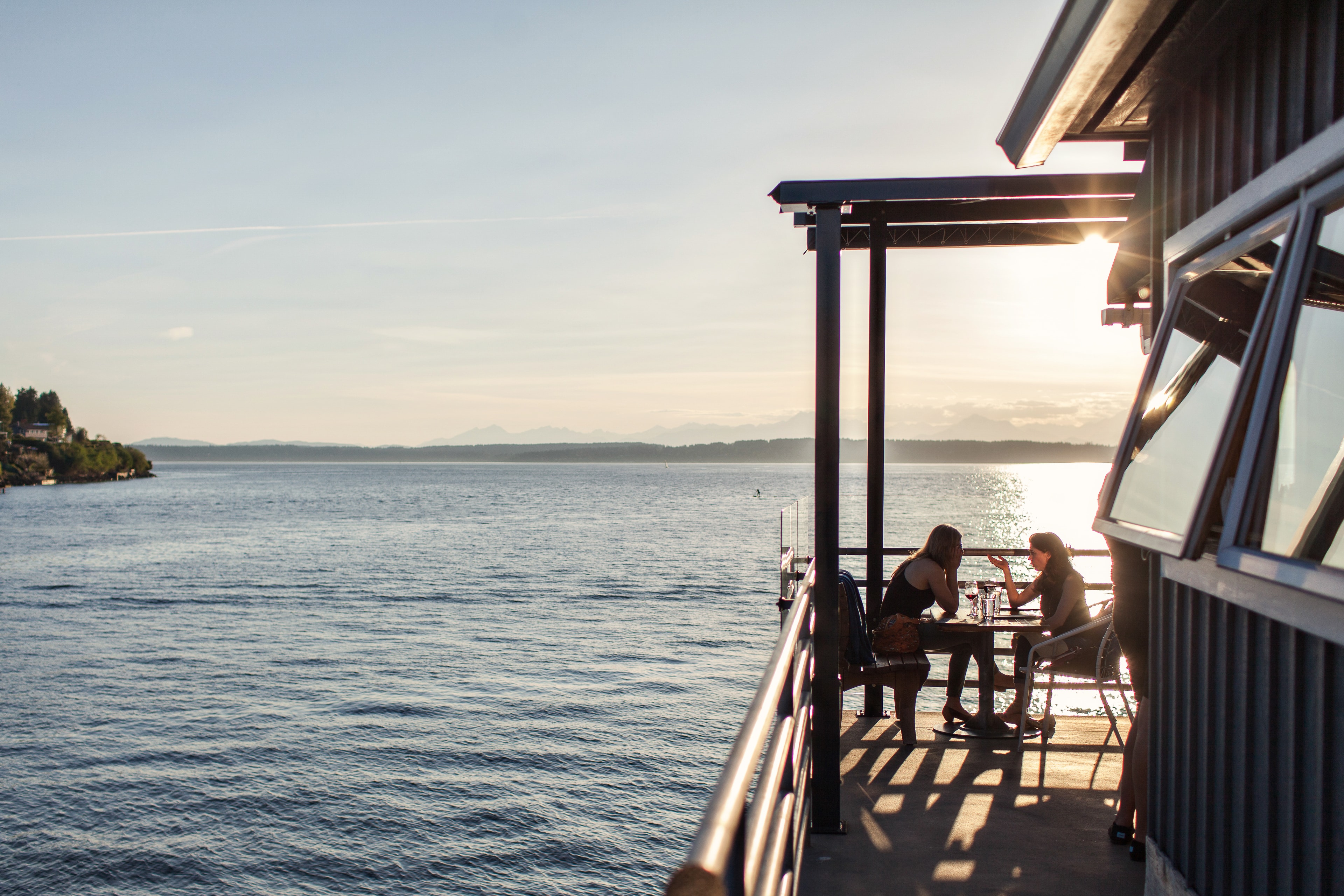 Waterfront Deck Dining at Sunset — Spaces photography by Spice & Ink