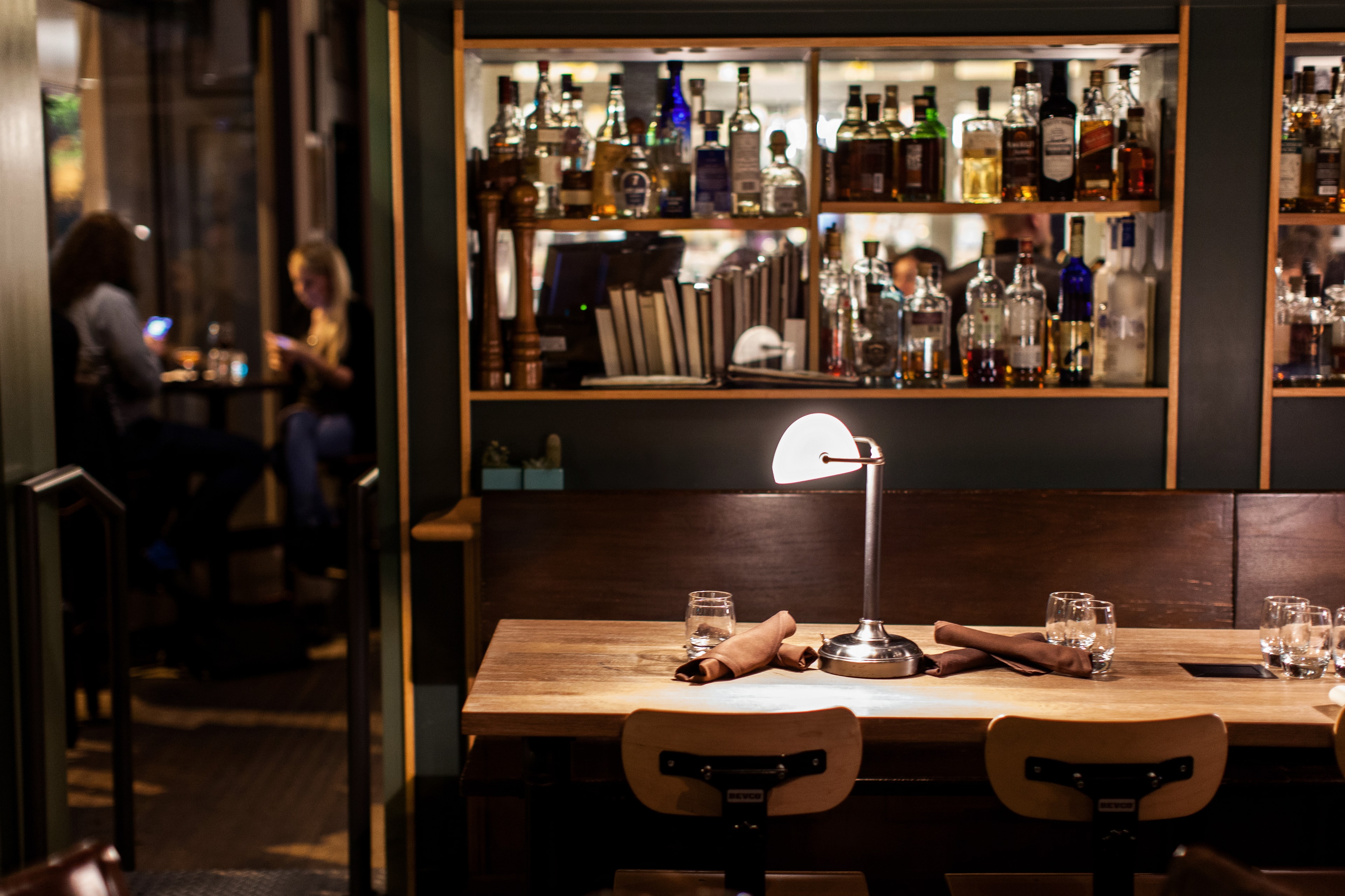 Upscale Bar Counter with Liquor Shelves — Spaces photography by Spice & Ink