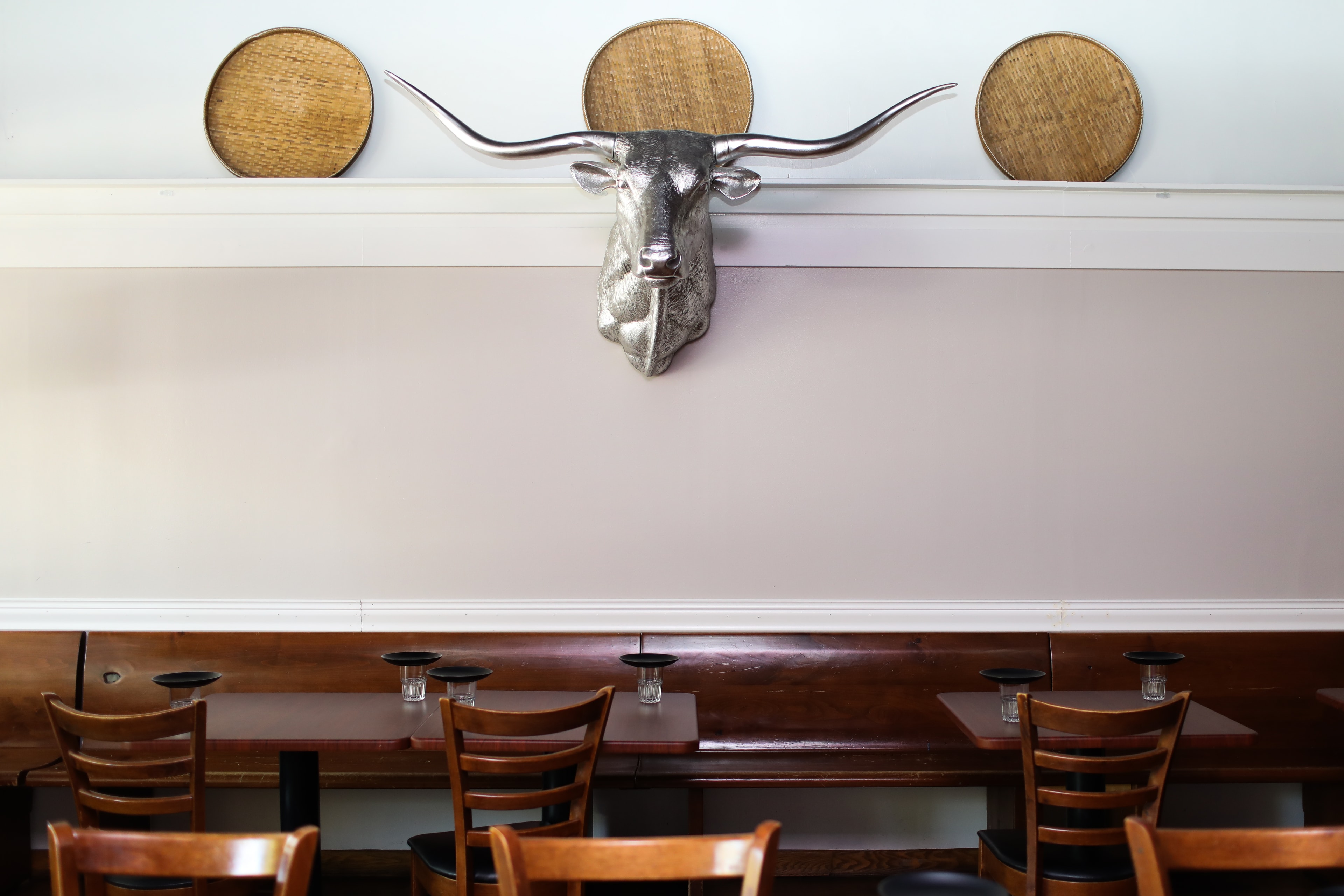 Silver Longhorn Sculpture with Woven Shields — Spaces photography by Spice & Ink